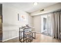 Charming dining area with table and chairs, near sliding door at 10606 W Granada Dr, Sun City, AZ 85373