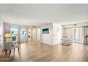 Bright and airy living room with laminate flooring at 10606 W Granada Dr, Sun City, AZ 85373