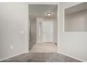Clean and bright foyer with tile flooring and neutral paint tones at 15380 N 100Th St # 1106, Scottsdale, AZ 85260