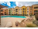 Stunning community pool with plenty of space for relaxing and enjoying the outdoors at 14575 W Mountain View Blvd # 11113, Surprise, AZ 85374