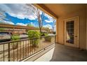 View from the condo patio showing convenient covered parking for residents and desert landscaping at 14575 W Mountain View Blvd # 11113, Surprise, AZ 85374