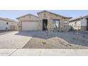 New construction home with landscaped front yard at 16367 W Morning Glory St, Goodyear, AZ 85338