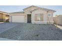 One-story home with stone accents and a two-car garage at 16425 W Desert Mirage Dr, Surprise, AZ 85388