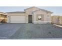 One-story home with stone accents and a two-car garage at 16425 W Desert Mirage Dr, Surprise, AZ 85388