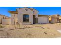 Newly built home with desert landscaping and a large garage at 266 S 165Th Ave, Goodyear, AZ 85338