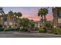 Attractive community entrance with lush landscaping at sunset at 4413 N 24Th Pl, Phoenix, AZ 85016