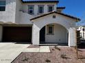 Front entrance of a two-story house with arched entryway at 2200 N Iowa St, Chandler, AZ 85225