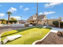 Large backyard with pool, spa, and artificial turf at 2929 E Bloomfield Rd, Phoenix, AZ 85032