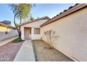 Side view of a house showing entrance and landscaping at 4723 N 84Th Ln, Phoenix, AZ 85037