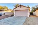 Attached garage with an automatic door and driveway at 4723 N 84Th Ln, Phoenix, AZ 85037