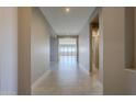 Bright hallway with tile floors leading to the living room at 18949 W Ocotillo Rd, Waddell, AZ 85355