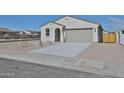 Charming single-story home featuring a neutral color palette, two-car garage and low maintenance desert landscaping at 24620 W Hopi W St, Buckeye, AZ 85326