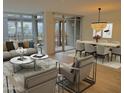 Bright living area with large windows, stylish decor, and an adjacent dining space at 4739 N Scottsdale Rd # 2002, Scottsdale, AZ 85251