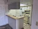 Bright kitchen boasts granite counters and updated cabinetry at 540 N May St # 2109, Mesa, AZ 85201