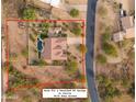 Aerial view of home with pool, detached RV garage space and landscaped yard at 730 E Mesquite St, Phoenix, AZ 85086