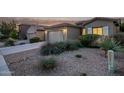 House exterior showcasing a two-car garage and neatly landscaped front yard at 5230 W El Cortez Trl, Phoenix, AZ 85083