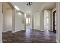 Elegant entryway with high ceilings and arched doorways at 2696 N 162Nd Ln, Goodyear, AZ 85395