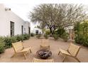 Relaxing patio with fire pit and lounge chairs at 12801 N 65Th Pl, Scottsdale, AZ 85254