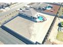 Expansive aerial view of property featuring pool, outdoor space, and privacy wall at 13524 W Sierra Vista Dr, Glendale, AZ 85307