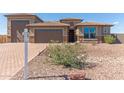 Gorgeous home with a three-car garage, desert landscaping and an attractive front entry at 13524 W Sierra Vista Dr, Glendale, AZ 85307