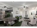 Inviting living room featuring an open layout, stylish decor, and gray cabinets at 2608 W Berridge Ln # 220, Phoenix, AZ 85017