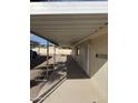 Long covered walkway alongside the manufactured home providing shade and protection at 3330 E Main St # 36, Mesa, AZ 85213