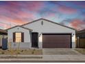 Inviting single-story home featuring desert landscaping, enhancing curb appeal at 16038 W Desert Hollow Dr, Surprise, AZ 85387