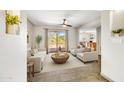 Inviting living room with neutral tones, tile floors, and sliding glass doors to the outdoor area at 37801 N Cave Creek Rd # 13, Cave Creek, AZ 85331