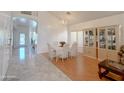 Bright dining room features a chandelier and hardwood floors at 1342 N Mckenna Ln, Gilbert, AZ 85233