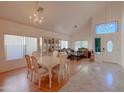 Bright dining room features a chandelier and hardwood floors at 1342 N Mckenna Ln, Gilbert, AZ 85233