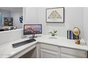 Home office nook with desktop, keyboard and globe at 4360 N 186Th Ln, Goodyear, AZ 85395