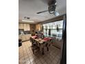 Kitchen with wood cabinets, tiled floor, and a breakfast table at 2310 N 40Th Dr, Phoenix, AZ 85009