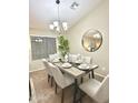 Bright dining room with a table set for six and a large mirror at 2946 E Quiet Hollow Ln, Phoenix, AZ 85024