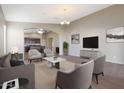 Spacious living room featuring comfortable seating and a view into the kitchen at 2946 E Quiet Hollow Ln, Phoenix, AZ 85024