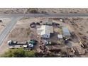 Aerial view showing a house and several outbuildings on a large lot at 12601 S Hermit Rd, Buckeye, AZ 85326