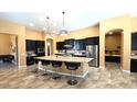 Gourmet kitchen featuring a large island and dark cabinetry at 2285 E Mead Dr, Gilbert, AZ 85298