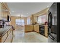 Bright kitchen with granite countertops, tile floors, and eat-in area at 6411 S River Dr # 26, Tempe, AZ 85283