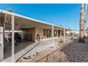 Side view of manufactured home showcasing covered carport and spacious parking area at 16246 N 32Nd Way, Phoenix, AZ 85032