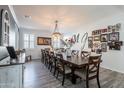 Bright dining room with a large table and Gathering photos on the wall at 1358 N St Paul --, Mesa, AZ 85205