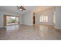 Spacious living room offers tile flooring, patio access, and abundant natural light at 8390 W Oraibi Dr, Peoria, AZ 85382