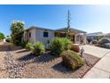 Charming single-story home with covered parking and attractive, low-maintenance desert landscaping at 215 N Power Rd # 361, Mesa, AZ 85205