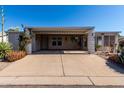 Charming single-story home with covered parking and well-maintained desert landscaping at 215 N Power Rd # 361, Mesa, AZ 85205