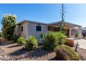 Charming single-story home with covered parking and attractive, low-maintenance desert landscaping at 215 N Power Rd # 361, Mesa, AZ 85205