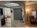 Bright and spacious entryway with tile flooring and seating area at 3824 E Kachina Dr, Phoenix, AZ 85044