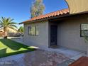 Brick patio with access to grassy backyard and additional building at 3824 E Kachina Dr, Phoenix, AZ 85044