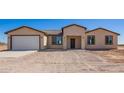 New construction home with attractive curb appeal and a welcoming front porch at 6300 N 419Th Ave, Tonopah, AZ 85354