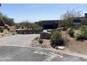 Charming exterior featuring a desert landscape and an address rock that adds to the curb appeal at 10336 E Chia Way, Scottsdale, AZ 85262