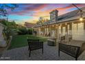Spacious backyard with patio, artificial turf, and fire pit at 2235 E Lakecrest Dr, Gilbert, AZ 85234