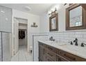 Bathroom with double vanity, marble countertop, and subway tile at 2235 E Lakecrest Dr, Gilbert, AZ 85234