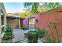 Brick paved courtyard with a water feature and gate at 2534 S Grandview Ave, Tempe, AZ 85282